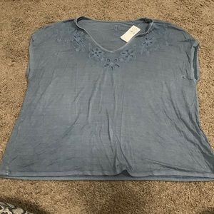 NEVER worn! Tags attached. Blue soft and sexy tee with some detail towards top